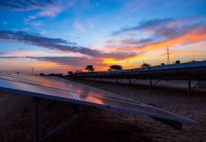 View of African solar power plant at sunset