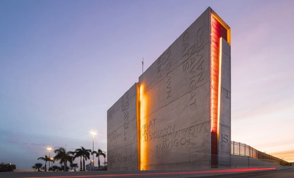 Concrete sculpture illuminated by coloured lights